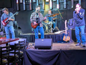 Tailgaters in Bolingbrook experiencing the Blues Drifters in action.