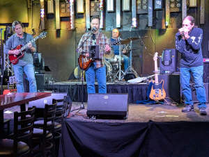 Tailgaters in Bolingbrook experiencing the Blues Drifters in action.